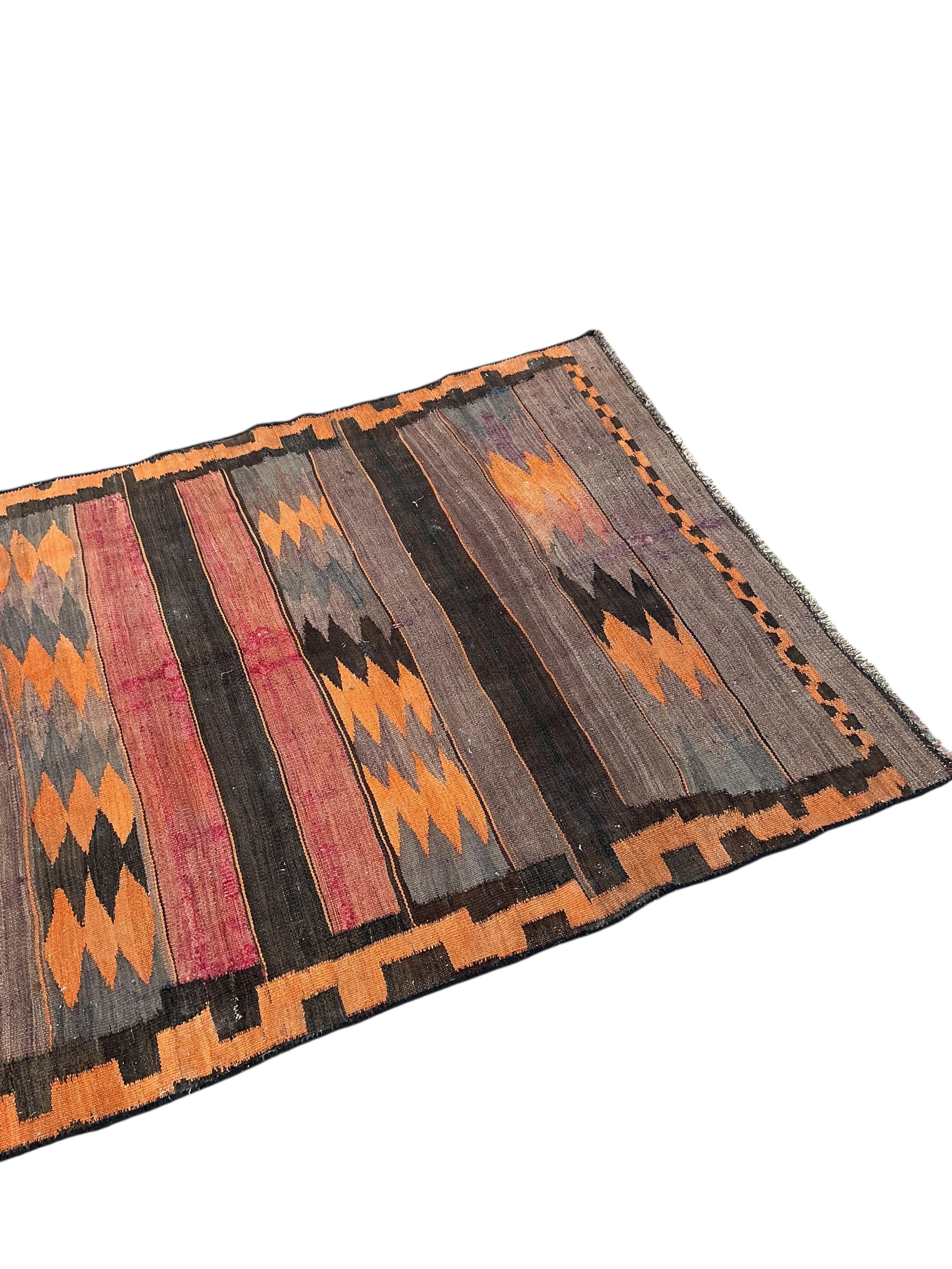A Turkish kilim flat weave hall carpet, 280 x 120cm